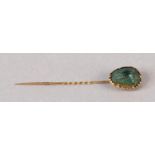 A VICTORIAN SCARAB STICK PIN IN 9CT GOLD, the iridescent carapace claw set with spiral twist pin,