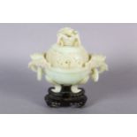 A CHINESE HARDSTONE CARVED INCENSE BURNER AND COVER OF PALE GREEN COLOUR, the domed cover with