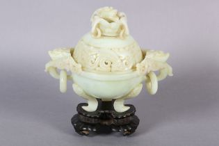 A CHINESE HARDSTONE CARVED INCENSE BURNER AND COVER OF PALE GREEN COLOUR, the domed cover with