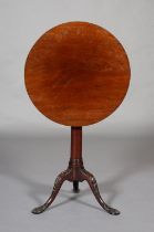 A GEORGE III MAHOGANY TILT TOP TABLE, associated circular top on a cannon turned column on tripod