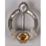 A VICTORIAN SCOTTISH PEBBLE SILVER PLATED BROOCH collet set with agates and an oval faceted