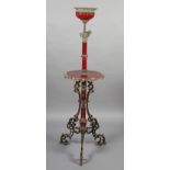 A LATE 19TH CENTURY CAST GILT METAL AND MAROON POTTERY STANDARD LAMP with circular tier and