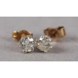 A PAIR OF DIAMOND STUD EARRINGS, each crown set with a brilliant cut stone on 9ct gold, post and