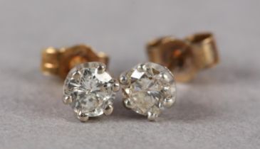 A PAIR OF DIAMOND STUD EARRINGS, each crown set with a brilliant cut stone on 9ct gold, post and