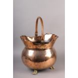 A LATE 19TH CENTURY PLANISHED COPPER COAL VASE, oval with swing handle, scalloped and folded rim