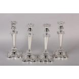 A SET OF FOUR GEORGE V SILVER CANDLESTICKS, Chester 1910 Herbert Edward and Frank Ernest Barker,