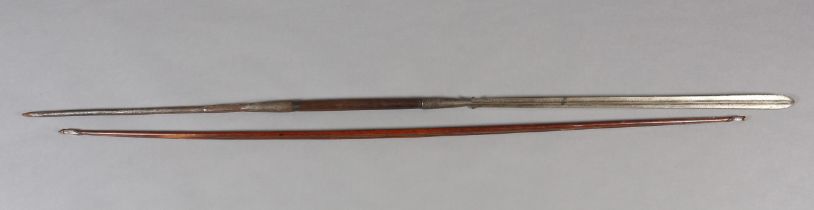 A MASAI LION SPEAR with 78cm flanged blade tapering to teardrop lugs and split ferrule, short hard