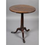 A GEORGE III MAHOGANY TRIPOD TABLE, circular, on a tapered cannon turned pedestal and on cabriole