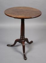 A GEORGE III MAHOGANY TRIPOD TABLE, circular, on a tapered cannon turned pedestal and on cabriole