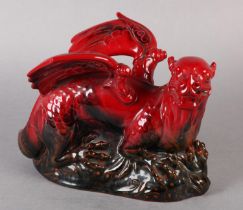 A ROYAL DOULTON VEINED FLAMBE FIGURE OF A DRAGON, modelled on a rock, marked to the front left paw