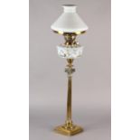 A VICTORIAN BRASS COLUMN OIL LAMP having an Italian Naples style reservoir moulded with a continuous