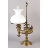 A VICTORIAN BRASS ALADDIN'S TYPE OIL LAMP cast, with flowering scrolls with gadroon rims, with