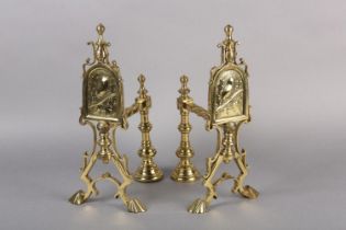 A PAIR OF AESTHETIC MOVEMENT BRASS FIRE DOGS, each with an arched panel worked with a robin