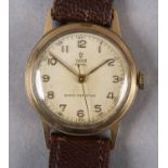 A TUDOR GENTLEMAN'S ROYAL MANUAL WRISTWATCH, c1952, in 9ct gold case made for ROLEX by AL Denison no