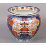 A CHINESE IMARI JARDINIERE, the lobed body painted with alternating panels of scrollwork, diaper