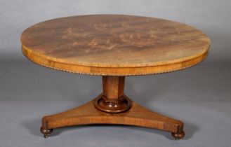 A MID 19TH CENTURY ROSEWOOD BREAKFAST TABLE, having a circular tilt top with bead and reel to the