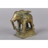 A LATE 18TH/EARLY 19TH CENTURY BRASS CAPARISONED ELEPHANT, cast and engraved in the South Indian
