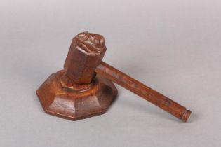 A THOMPSON OF KILBURN 'MOUSEMAN' OAK GAVEL AND BLOCK, of octagonal form, the head of the gavel