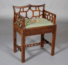 A CHINESE CHIPPENDALE REVIVAL mahogany dressing stool, having a low fretwork back and side panels,