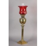 A VICTORIAN BRASS CORINTHIAN COLUMN LAMP the reservoir relief moulded with foliage, having a