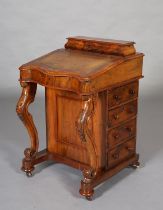 A MID VICTORIAN WALNUT DAVENPORT, with raised stationery compartment, leather incised fall front