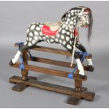A MID/LATE 20TH CENTURY ROCKING HORSE IN THE STYLE OF COLLINSON having black and white dappled