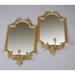 A PAIR OF 19TH CENTURY GIRANDOLES OF ARCHED OUTLINE having laurel leaf moulded frame and triple