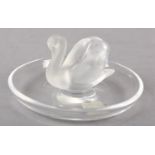 A LALIQUE GLASS TRINKET DISH with frosted glass swan raised to the centre, signed Lalique, France to