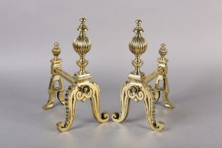 A PAIR OF VICTORIAN BRASS FIREDOGS, each having a reeded ball and baluster upright, on frilled and
