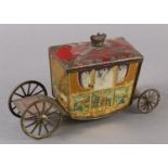 A W&R JACOB & CO LTD TIN PLATE BISCUIT TIN formed as a coach, the side panels containing classical