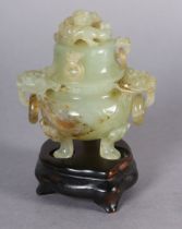 A CHINESE CARVED HARDSTONE INCENSE BURNER AND COVER OF PALE GREEN COLOUR, the domed cover with