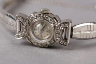 AN OMEGA LADY'S DIAMOND SET COCKTAIL WATCH C1954 in 18ct white gold, 17 jewelled lever 213