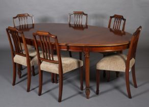 A TITCHMARCH & GOODWIN MAHOGANY DINING SUITE, comprising an oval table on fluted and leaf capped