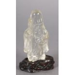 A CHINESE ROCK CRYSTAL FIGURE OF LOHAN, 10.5cm high with hardwood stand