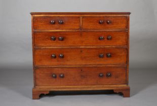 AN EARLY 19TH CENTURY MAHOGANY CHEST of two short and three long, graduated drawers each with