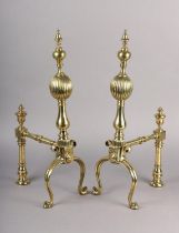 A PAIR OF VICTORIAN BRASS FIRE DOGS, each having a reeded ball and baluster upright with knop