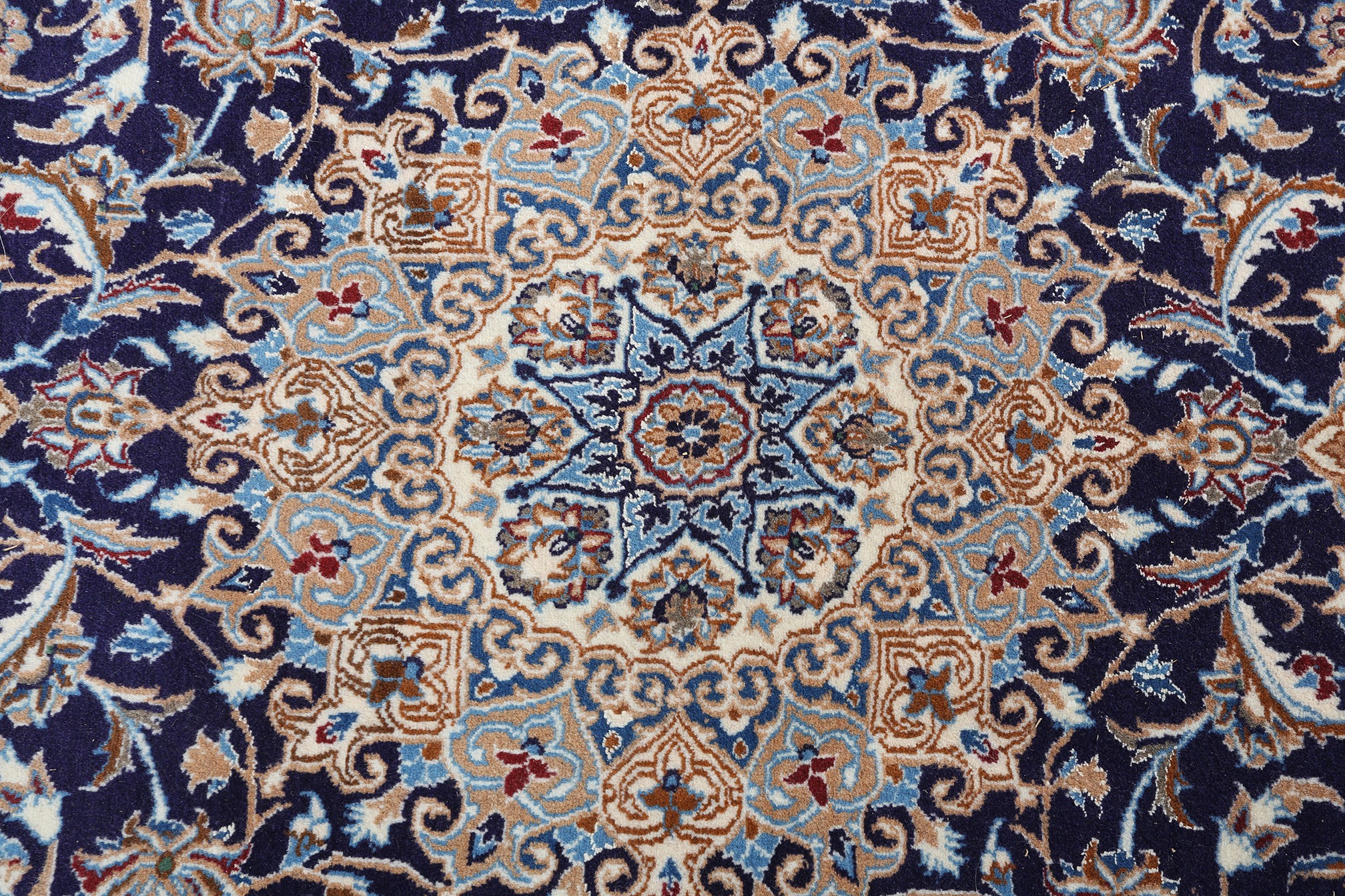 A MIDDLE EASTERN CARPET, Persian, having a blue field filled with flowering tendrils and central - Image 2 of 4