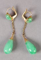 A PAIR OF JADE EAR PENDANTS C1950, in 14ct gold, each set with a pear shaped jade drop hung on a