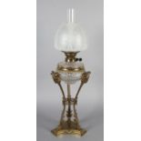 AN EARLY 20TH CENTURY ORMOLU MOUNTED OIL LAMP having a Messenger Patent Duplex burner, the cut glass