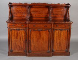 A VICTORIAN FIGURED MAHOGANY SIDEBOARD OR CHIFFONIER, having a triple panel raised back with wavy