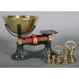 A PAIR OF VICTORIAN BRASS AND ENAMELLED WEIGHING SCALES AND WEIGHTS, by W&T Avery Ltd, Birmingham,
