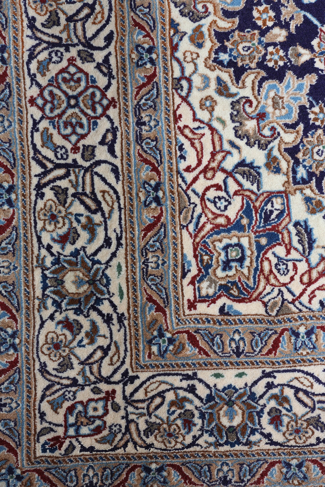 A MIDDLE EASTERN CARPET, Persian, having a blue field filled with flowering tendrils and central - Image 3 of 4