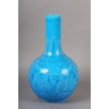 A CHINESE TURQUOISE GLAZED VASE, the elongated neck incised with a band of stiff leaves above a