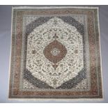 A MIDDLE EASTERN CARPET, the deep blue field having an ivory panel filled with scrolling leafage and