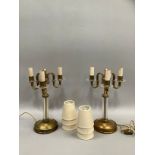 A PAIR OF CONTINENTAL ART DECO AND BRASS GLASS THREE LIGHT TABLE LAMPS, the serpentine arms with