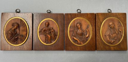 A SET OF FOUR EARLY 17TH CENTURY FLEMISH DEVOTIONAL BOXWOOD MEDALLIONS, oval, finely carved in