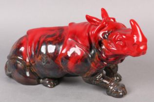 A ROYAL DOULTON VEINED FLAMBE RHINO, modelled in recumbent position, marked to the base with stamp