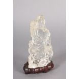 A CHINESE ROCK CRYSTAL FIGURE OF THE IMMORTAL MAGU, holding a fruiting branch, a deer at her feet,