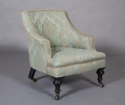 A VICTORIAN PALE GREEN UPHOLSTERED NURSING CHAIR, on turned ebonised legs with castors