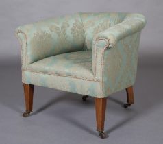 AN EDWARD VII PALE GREEN UPHOLSTERED TUB-SHAPED CHAIR, on mahogany square legs with castors